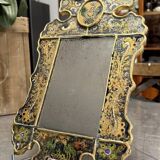 Eglomise glass mirror with scrollwork and branch races decoration