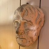 Plaster face wall statue
