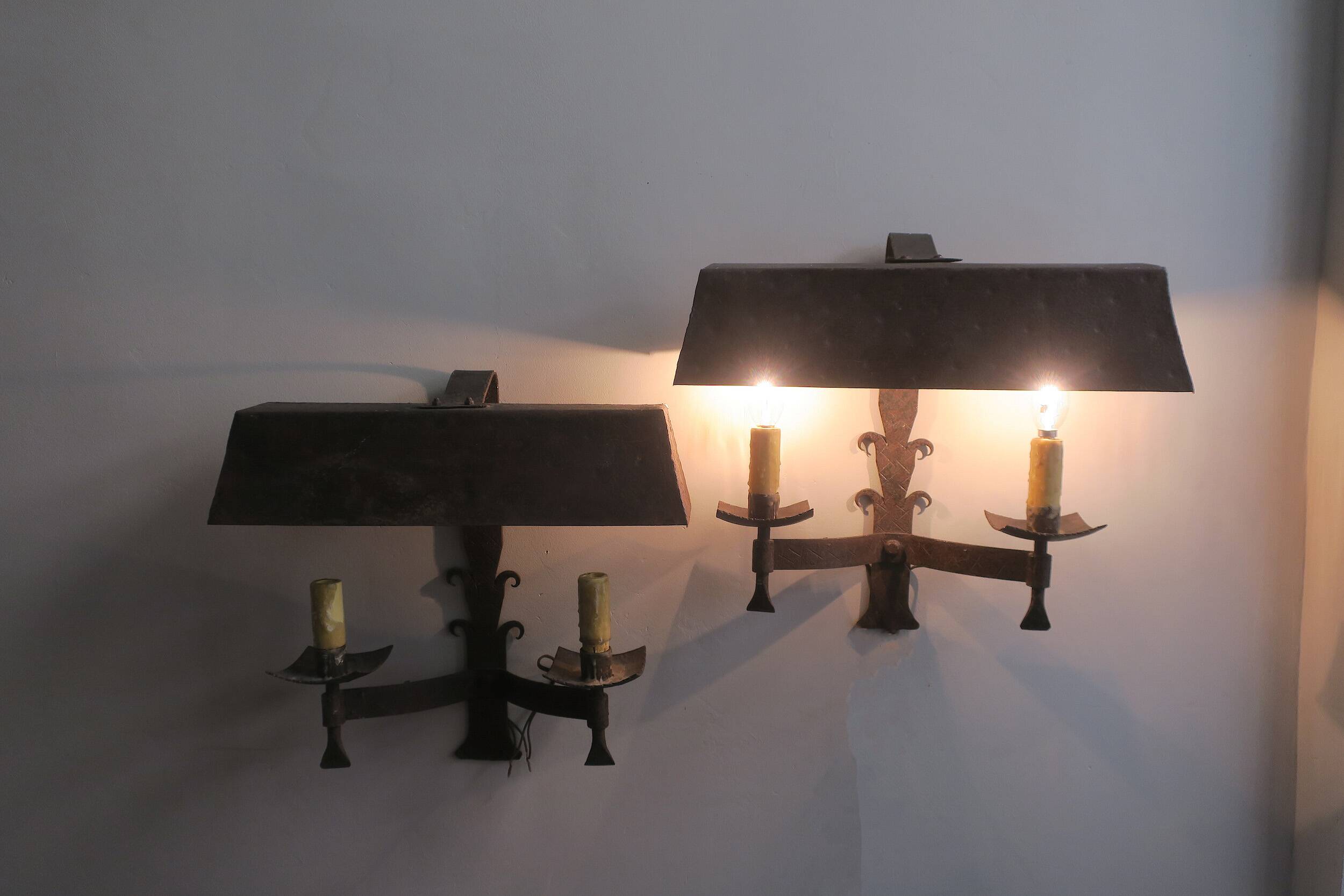 Pair of mid century Brutalist patinated iron wall lights, 1950s-60s