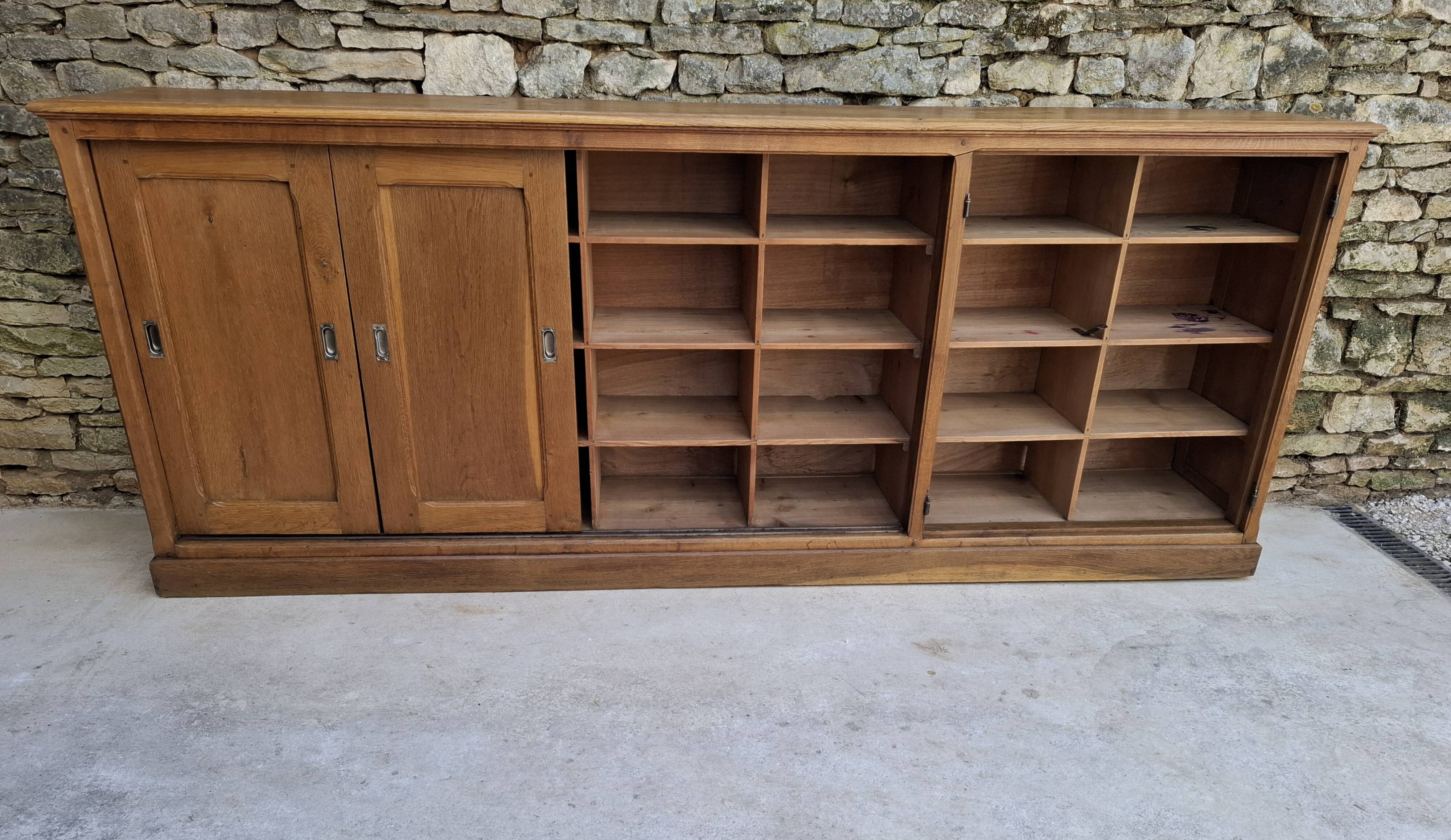 Oak workshop furniture with sliding doors.