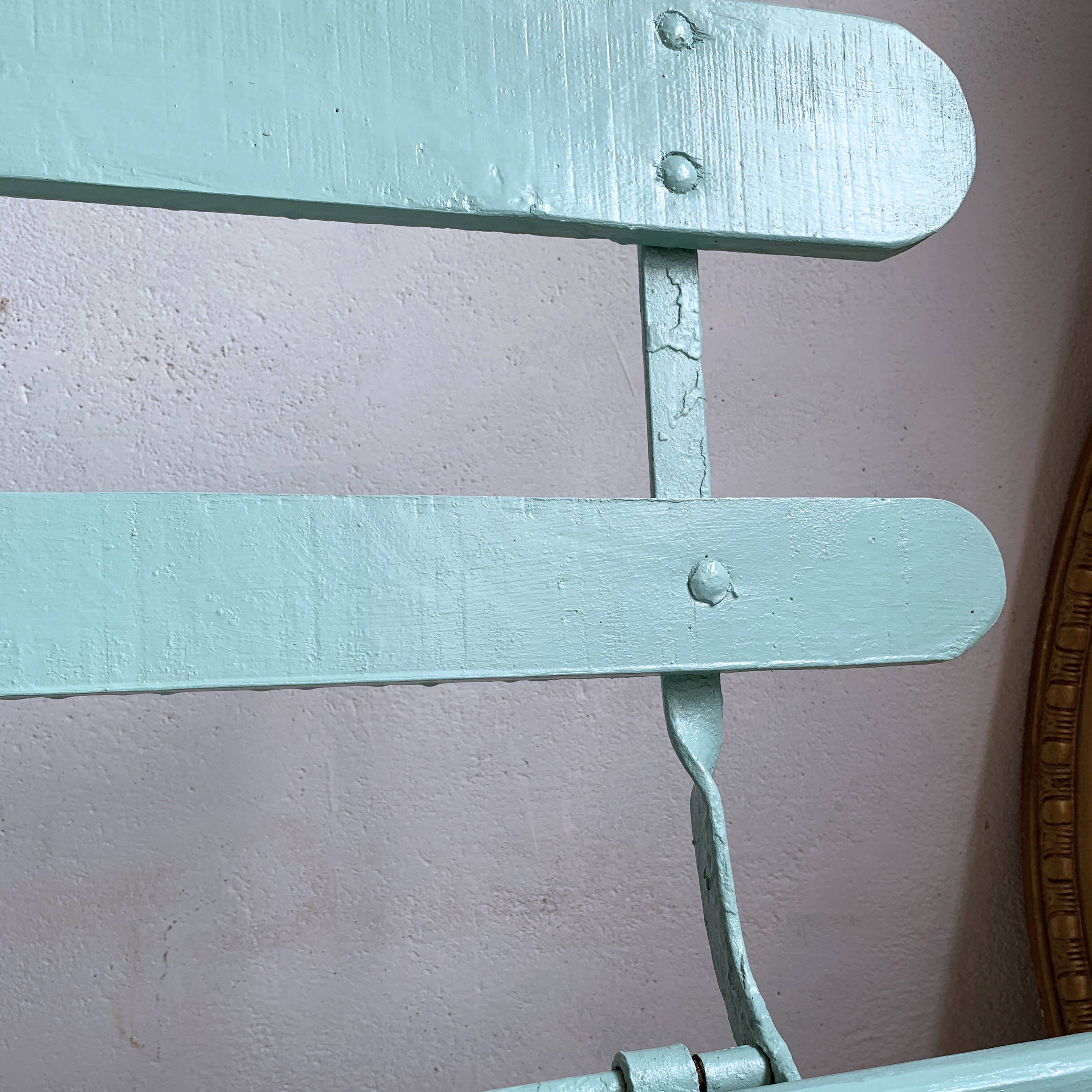 Former folding garden bench with wooden and metal slats