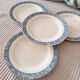 Lot de 4 belles assiettes plates en terre de fer