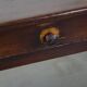Antique French fruitwood dining table with 2 drawers and patina