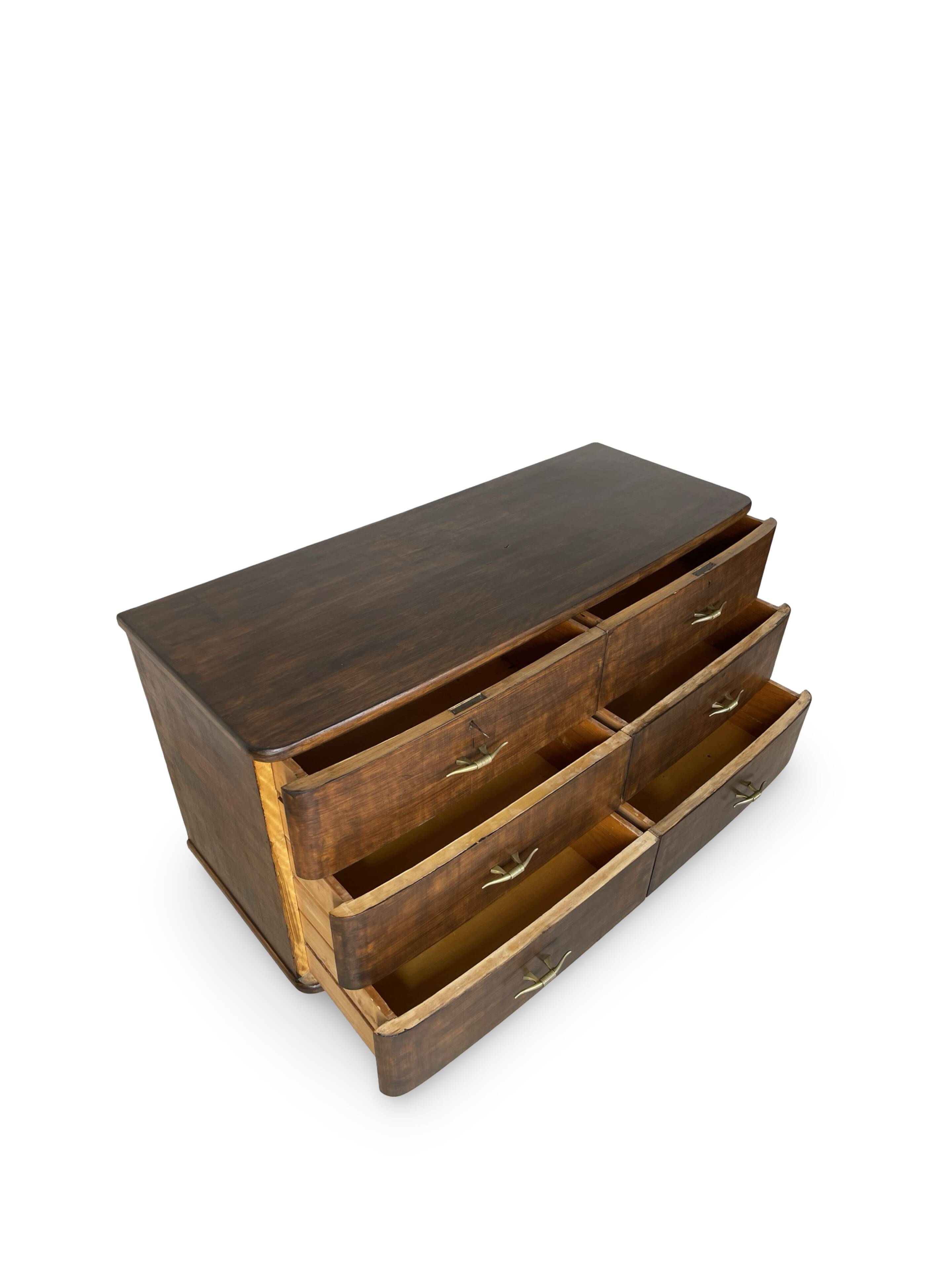 A vintage Italian chest of drawers, made of veneered walnut and solid wood,