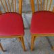 Pair of red Baumann skai chairs 1960