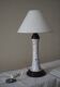 Table lamp for bedside use in earthenware with a wooden base.
