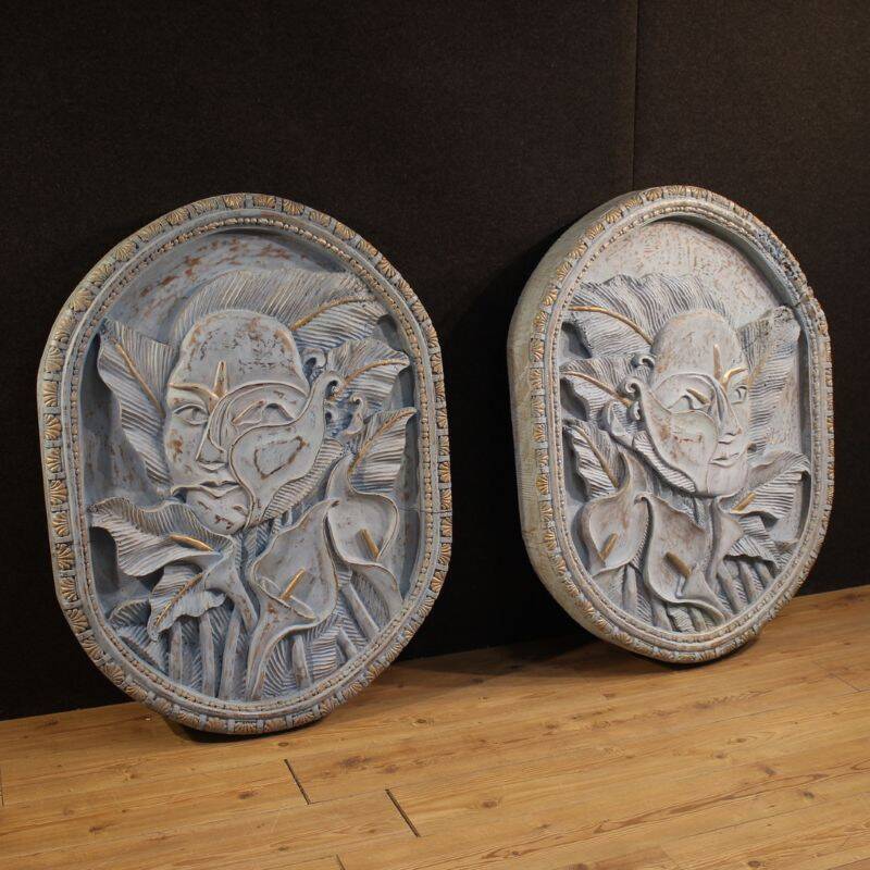 Bas-relief sculpture, stylized face with flowers, 20th century