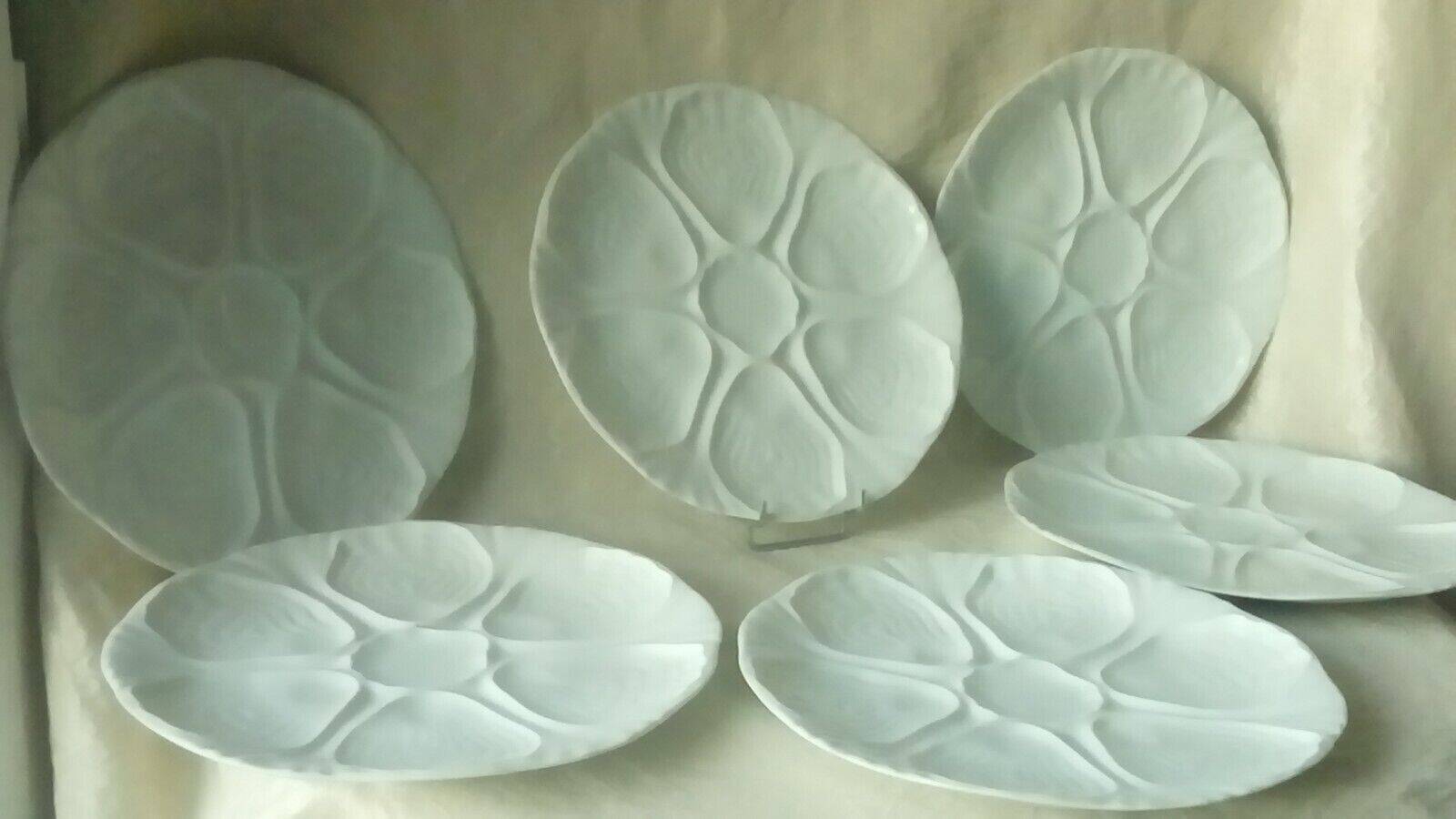 White porcelain oyster plates