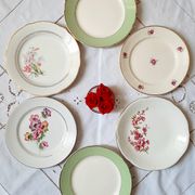 Flat antique earthenware plates with gilded edges
