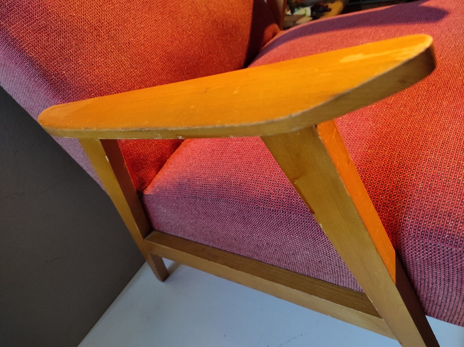 Vintage red armchair with compass feet in Scandinavian design