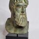 Bust of Poseidon in patinated plaster on wooden base
