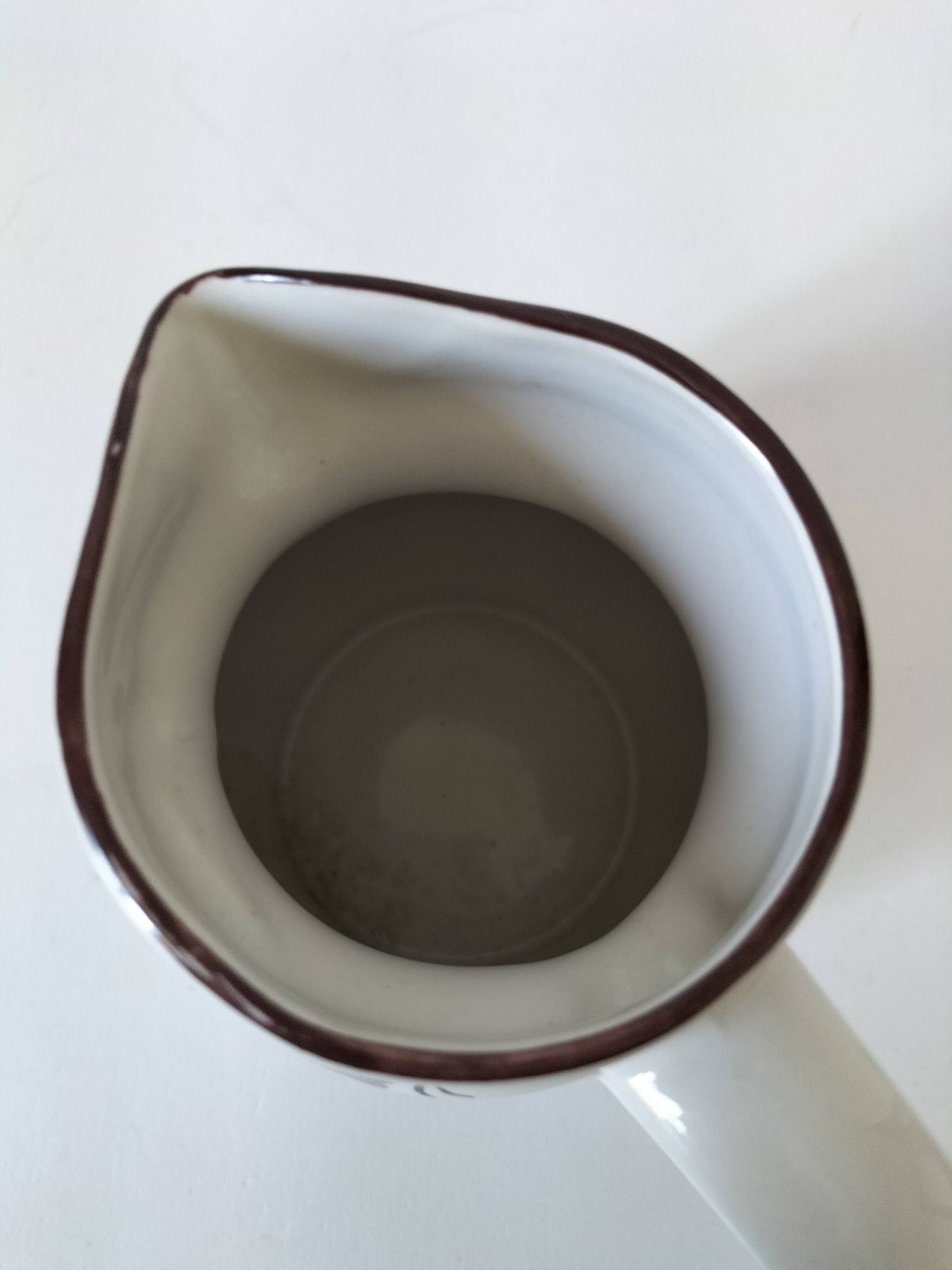 Ceramic pitcher from Quimper, created by Dominique Villard.