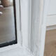 Old mirror, Louis Philippe style, white and gold patina, antique French