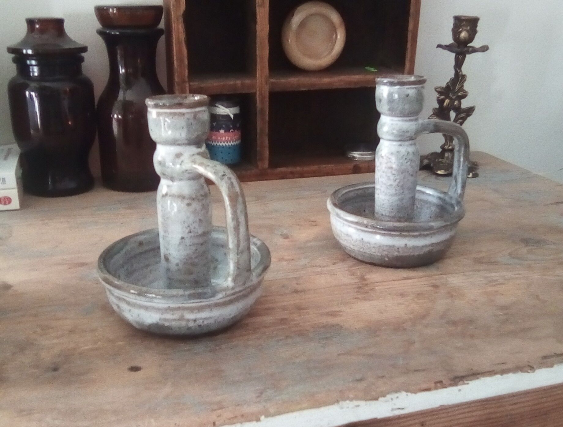 Pair of speckled sandstone candle holders