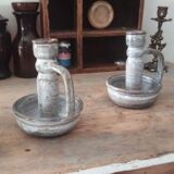 Pair of speckled sandstone candle holders