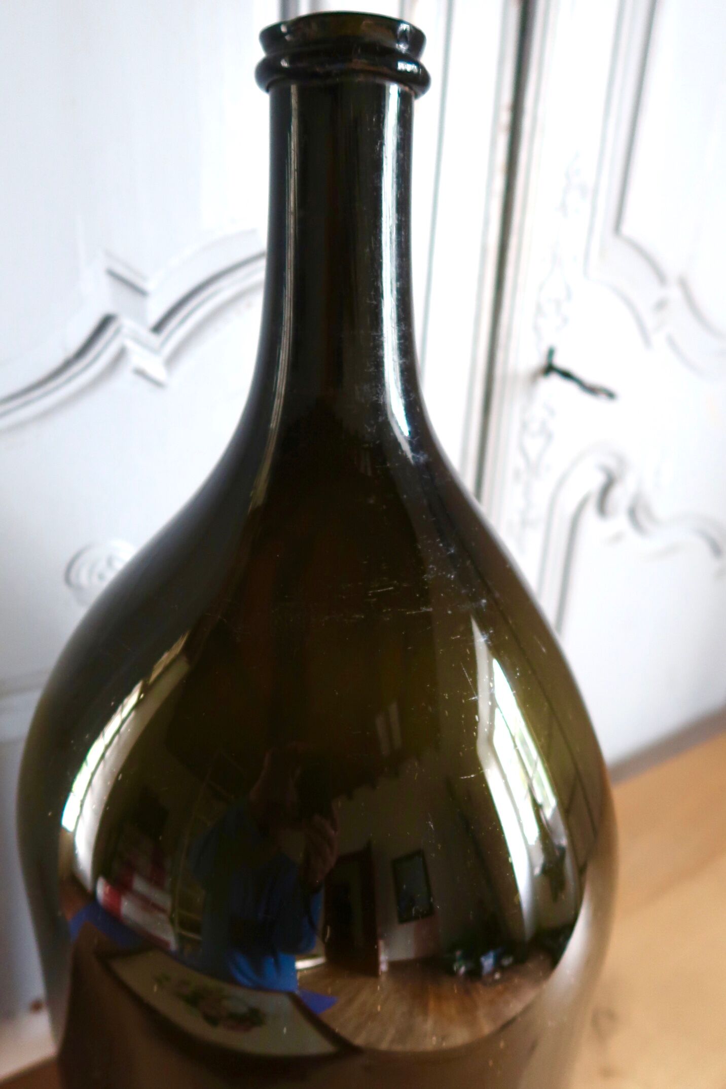 Large old bottle dame-jeanne dark green