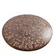 Vintage round wooden coffee table with a copper top.