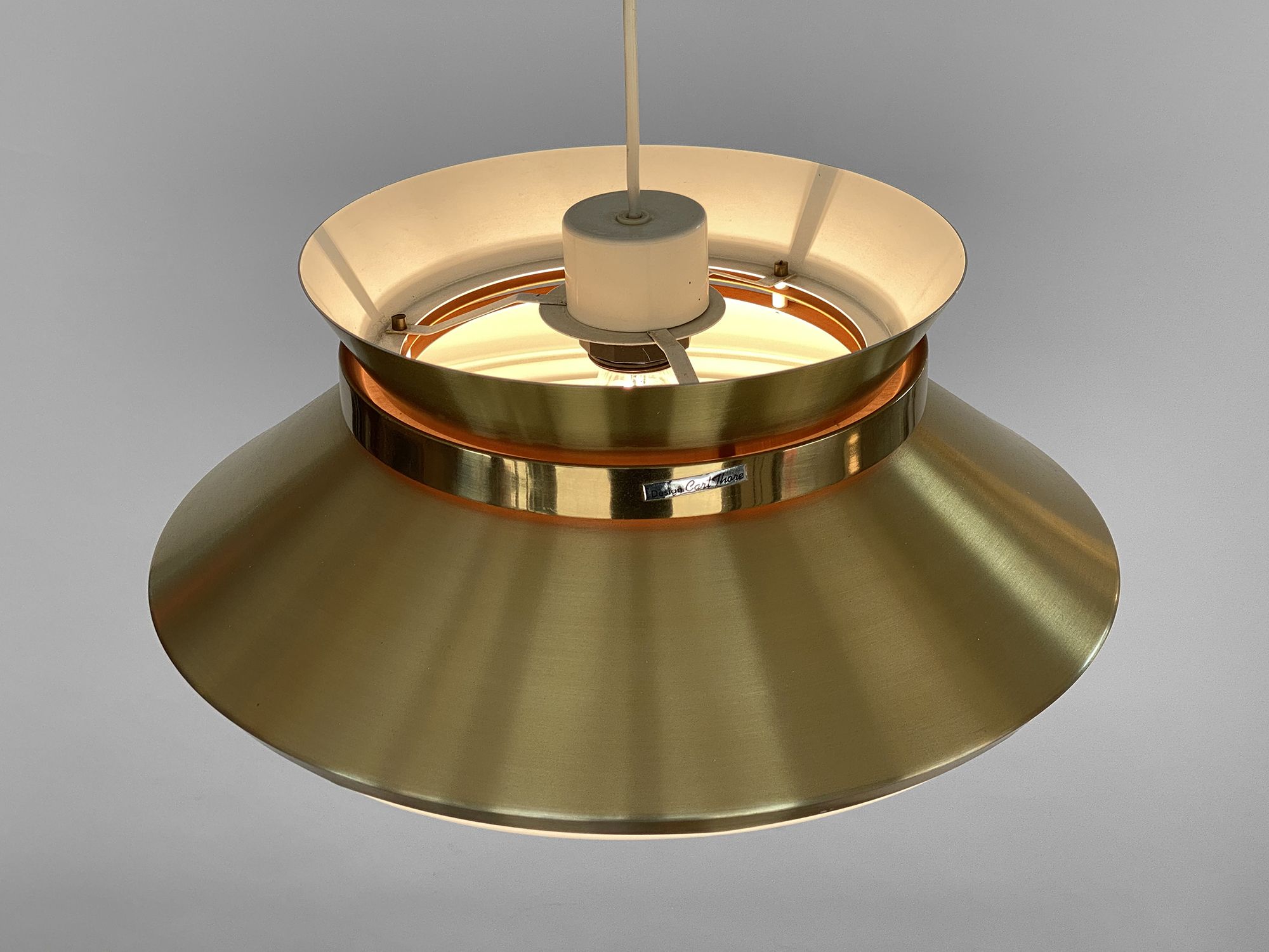 Brass colored aluminium pendant light by Carl Thore for Granhaga Metall. Sweden 1970s.