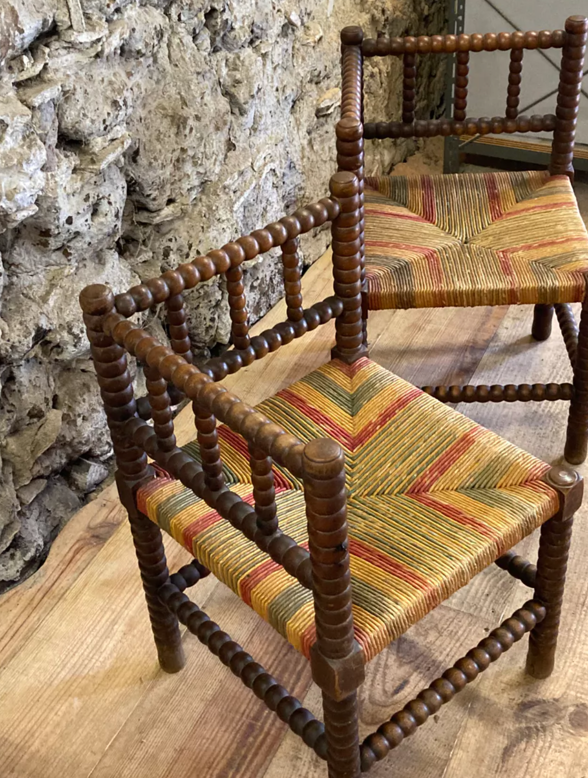 Pair of corner armchairs paillés in turned wood antique multicolored seat