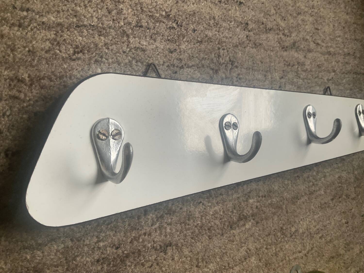 Duo of asymmetrical Formica coat racks from the 60s