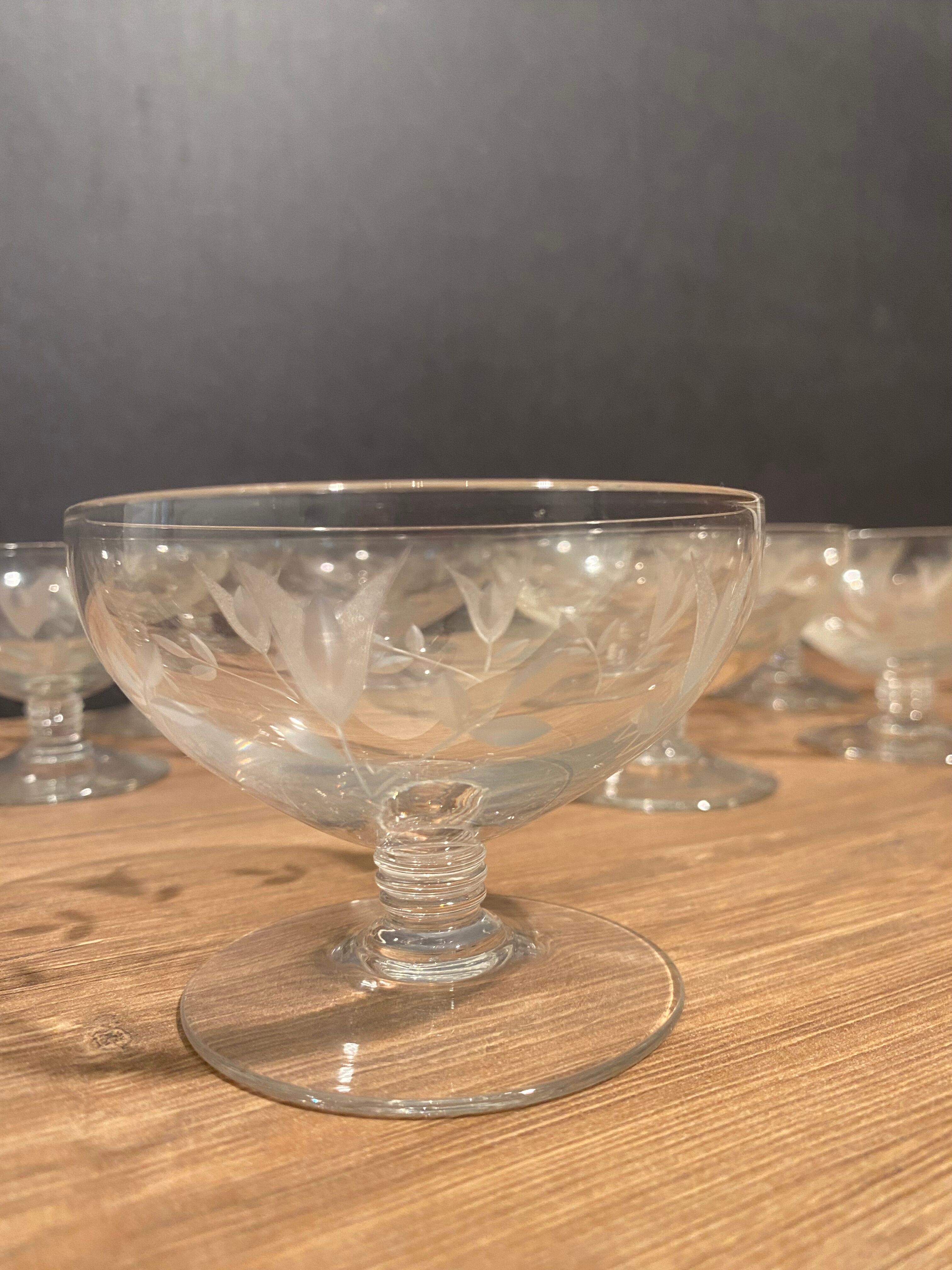 Suite of 12 champagne glasses in cut glass with floral decoration