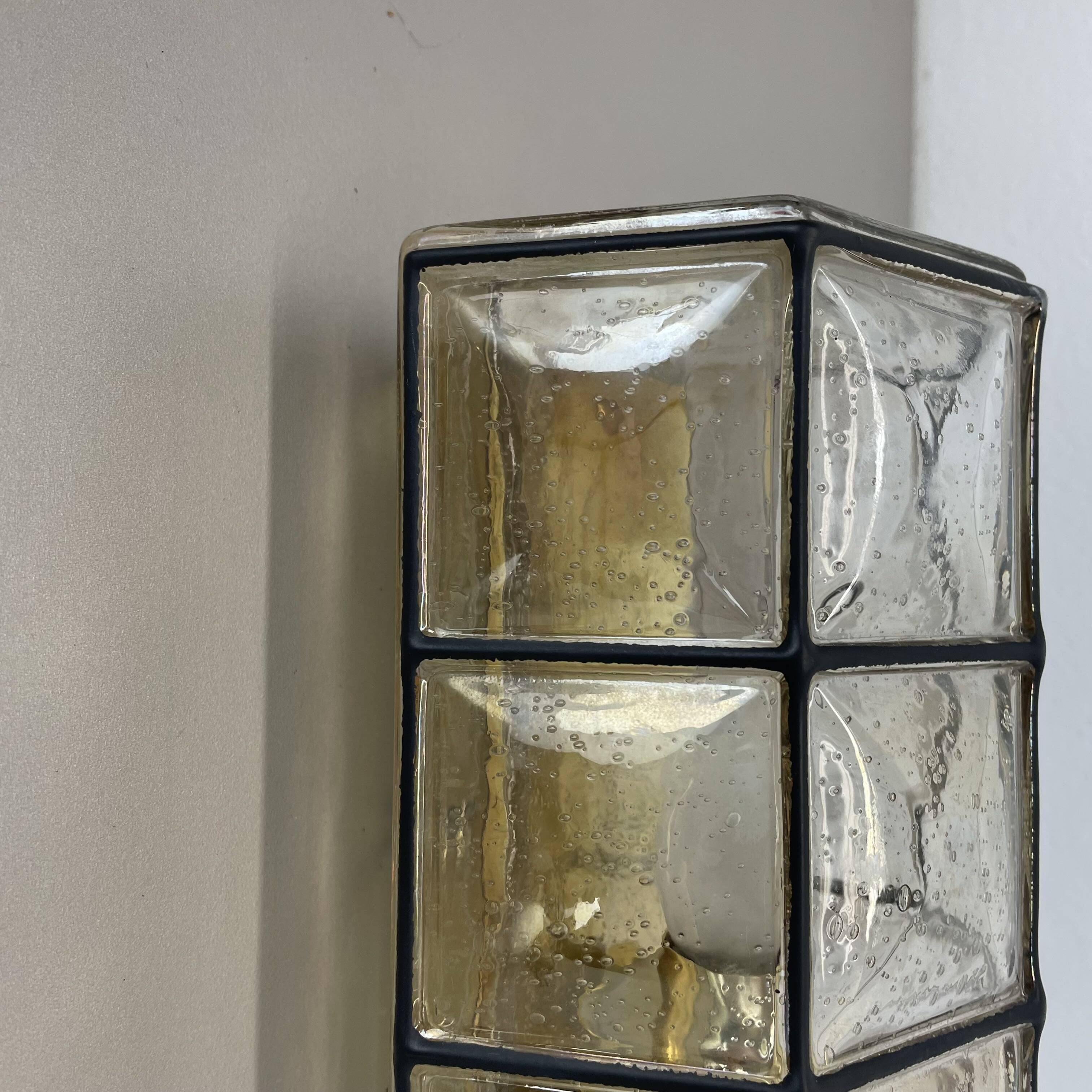 Wall light "Iron Rings" in brass and glass by Glashütte Limburg, Germany, 1970s