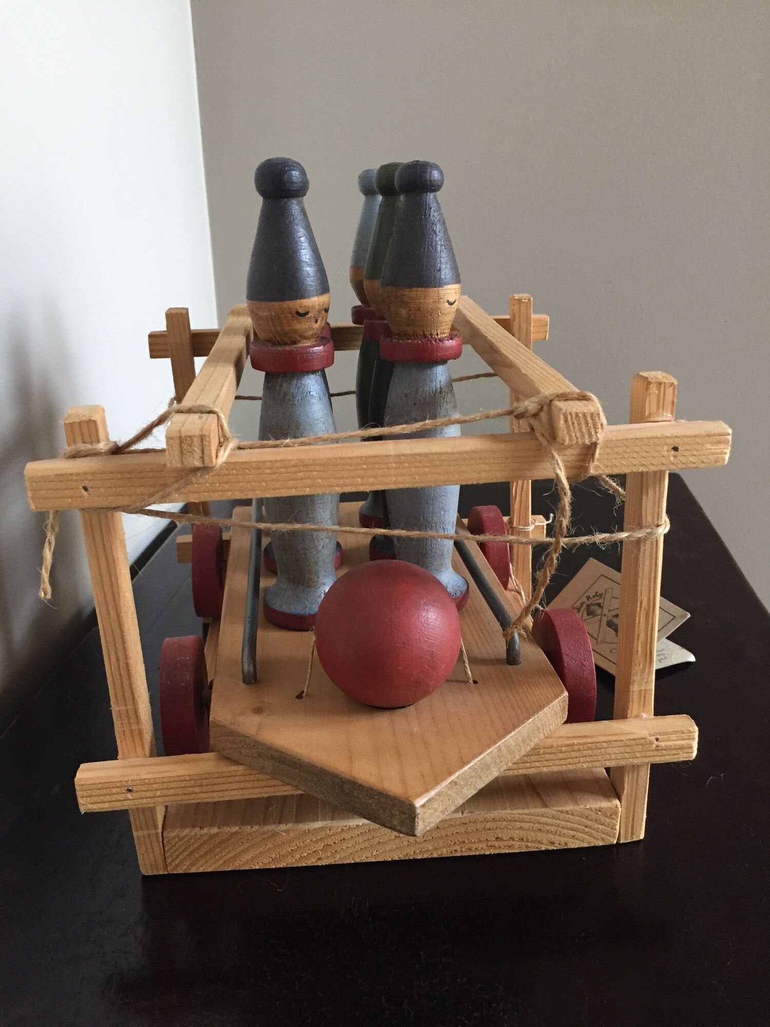 Set of Moulin Roty brand wooden bowling on roller cart, limited series.