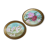 Pair of stucco frames and oil bouquets