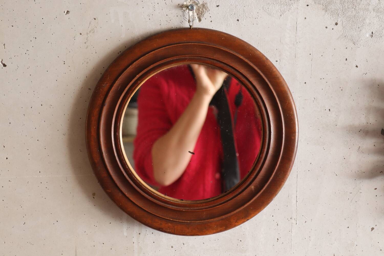 Round old wooden mirror