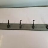 Wooden coat rack with cast iron hooks