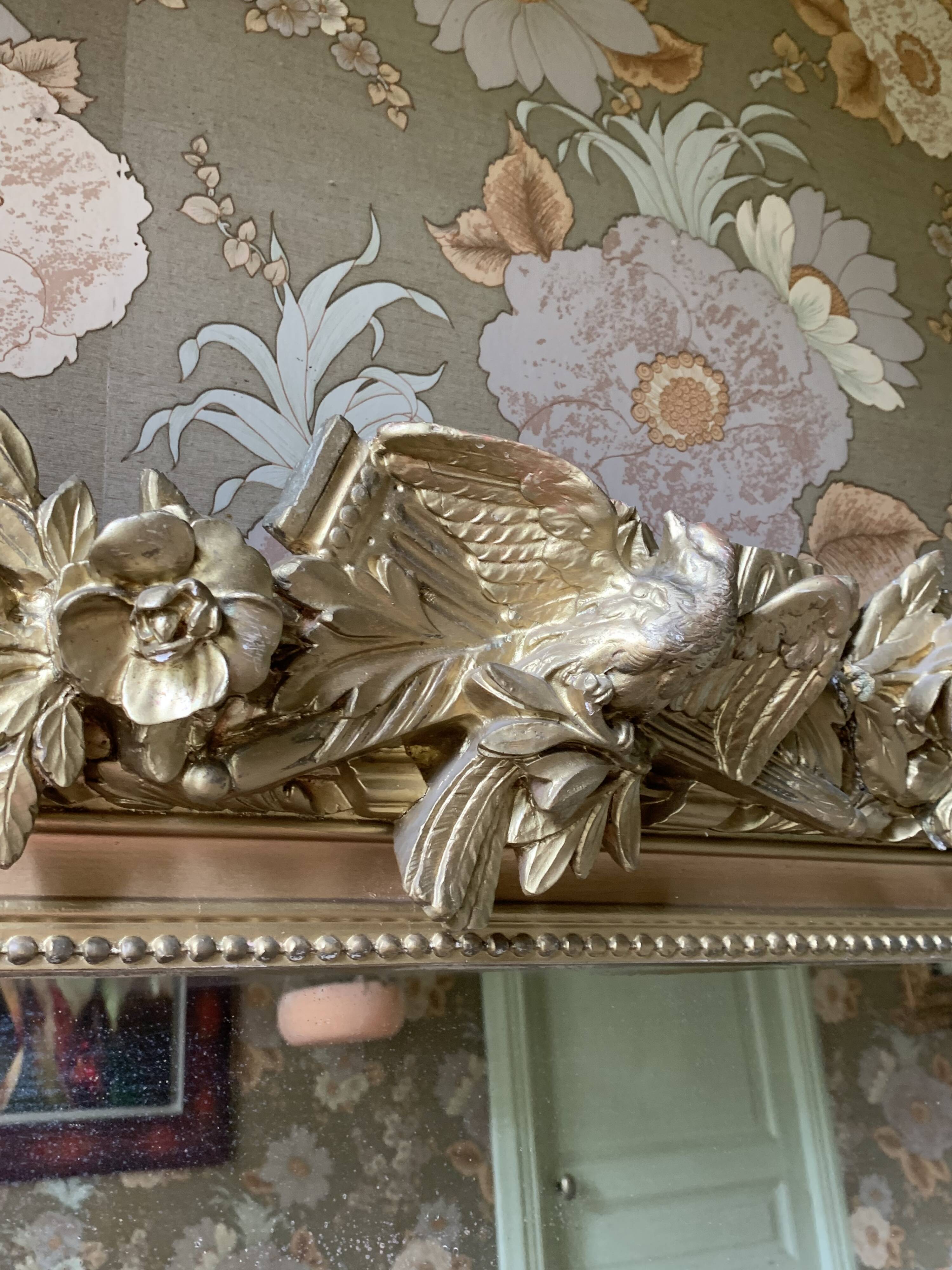 Gilded wooden fireplace mirror with pediment