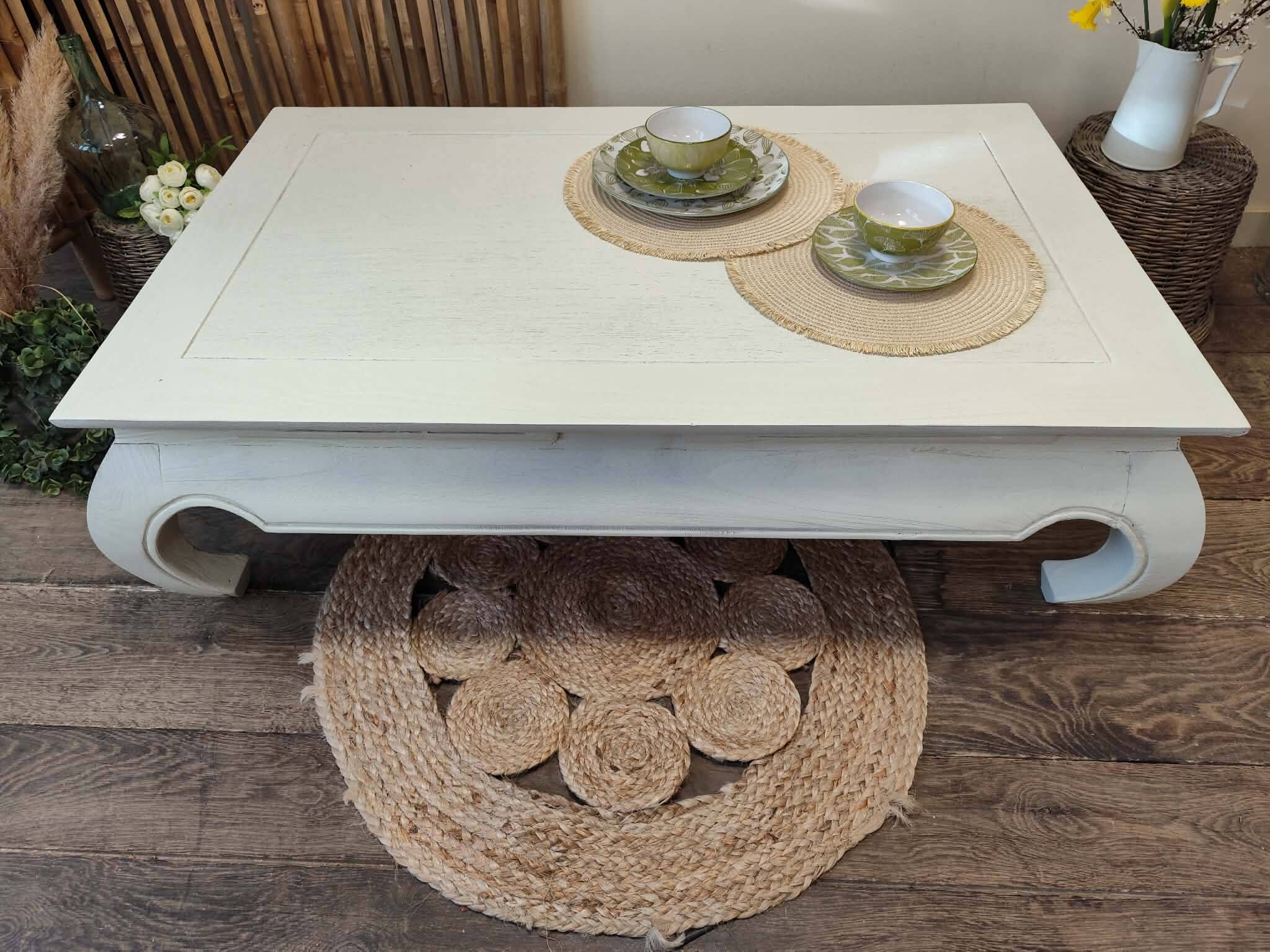 Exotic wood coffee table with its safety glass protection.