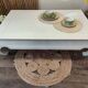 Exotic wood coffee table with its safety glass protection.