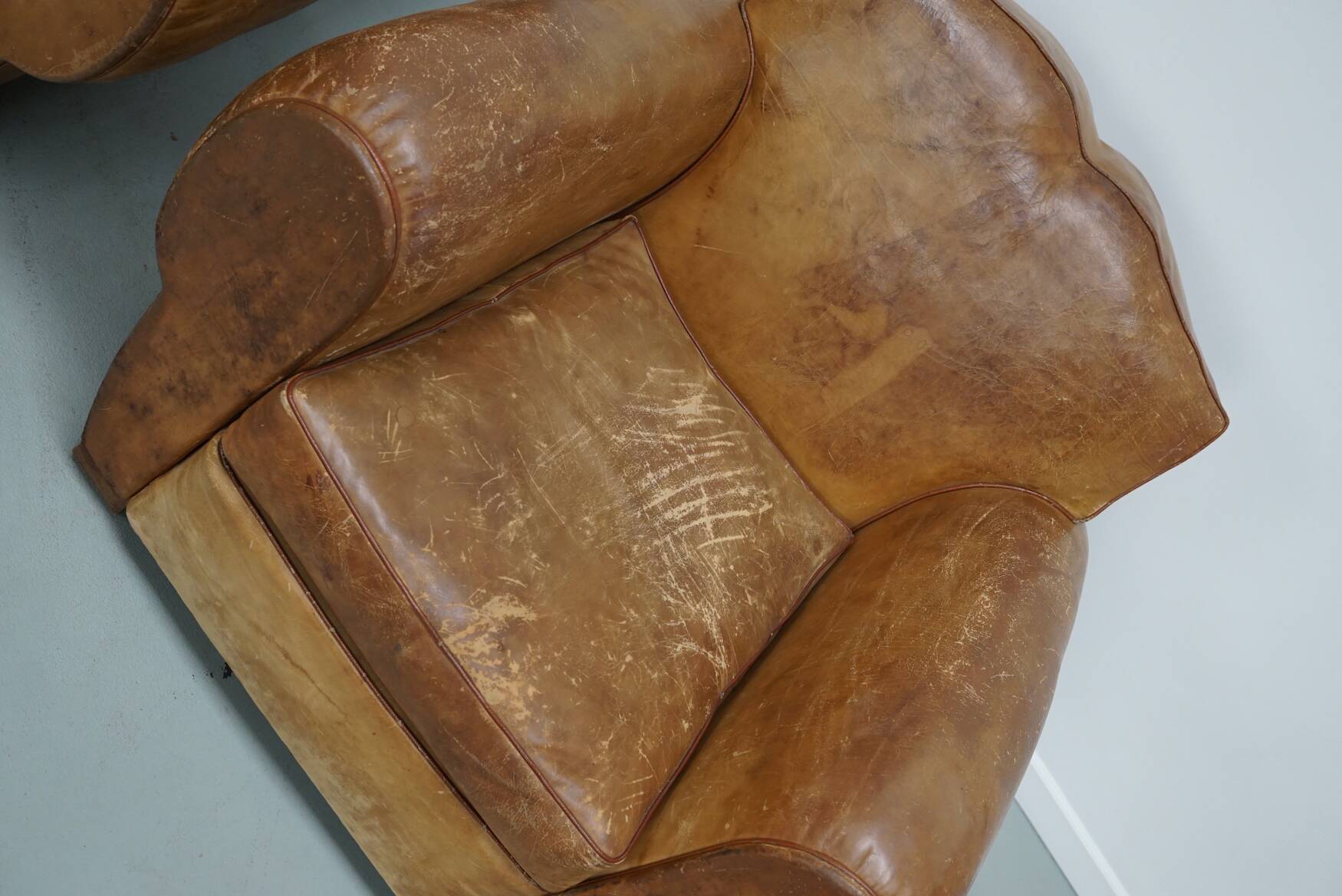 Pair of French club chairs with moustache back in cognac leather, 1940s