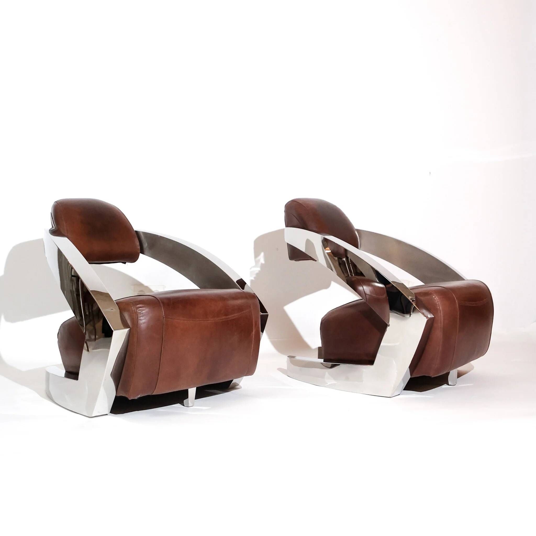 Pair of vintage lounge chairs Demon/Aviator in cognac leather and polished steel, Art Deco style.