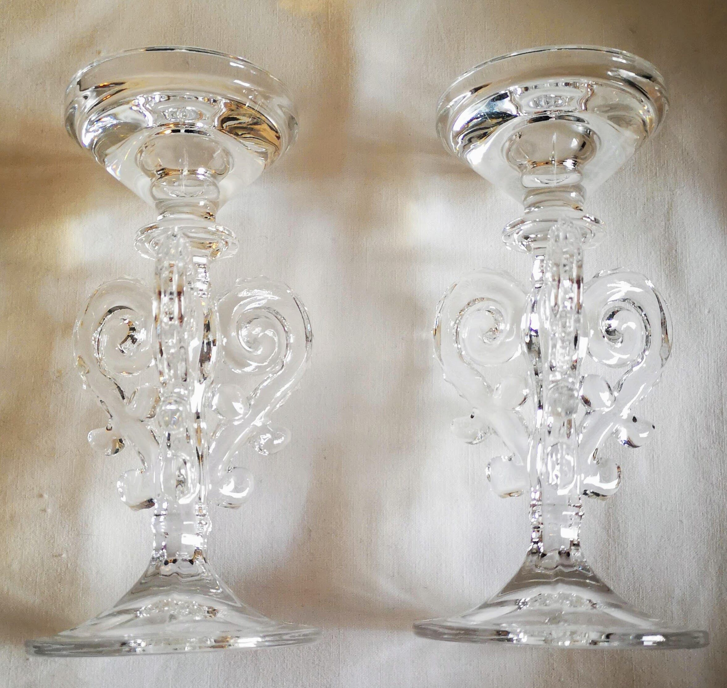 Pair of glass volute candlesticks