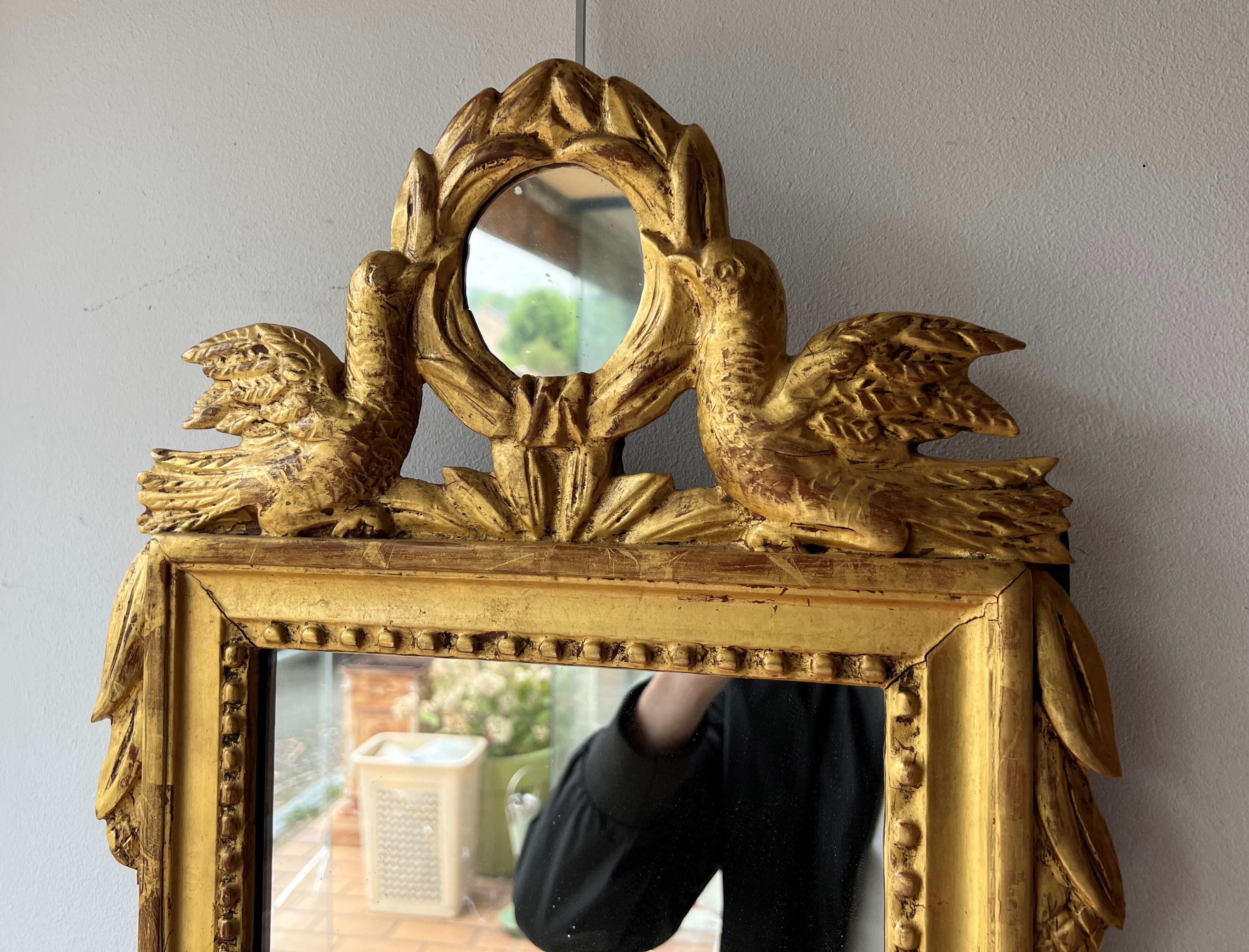 Mirror between two Louis XVI style in gilded wood with leaf around 1900