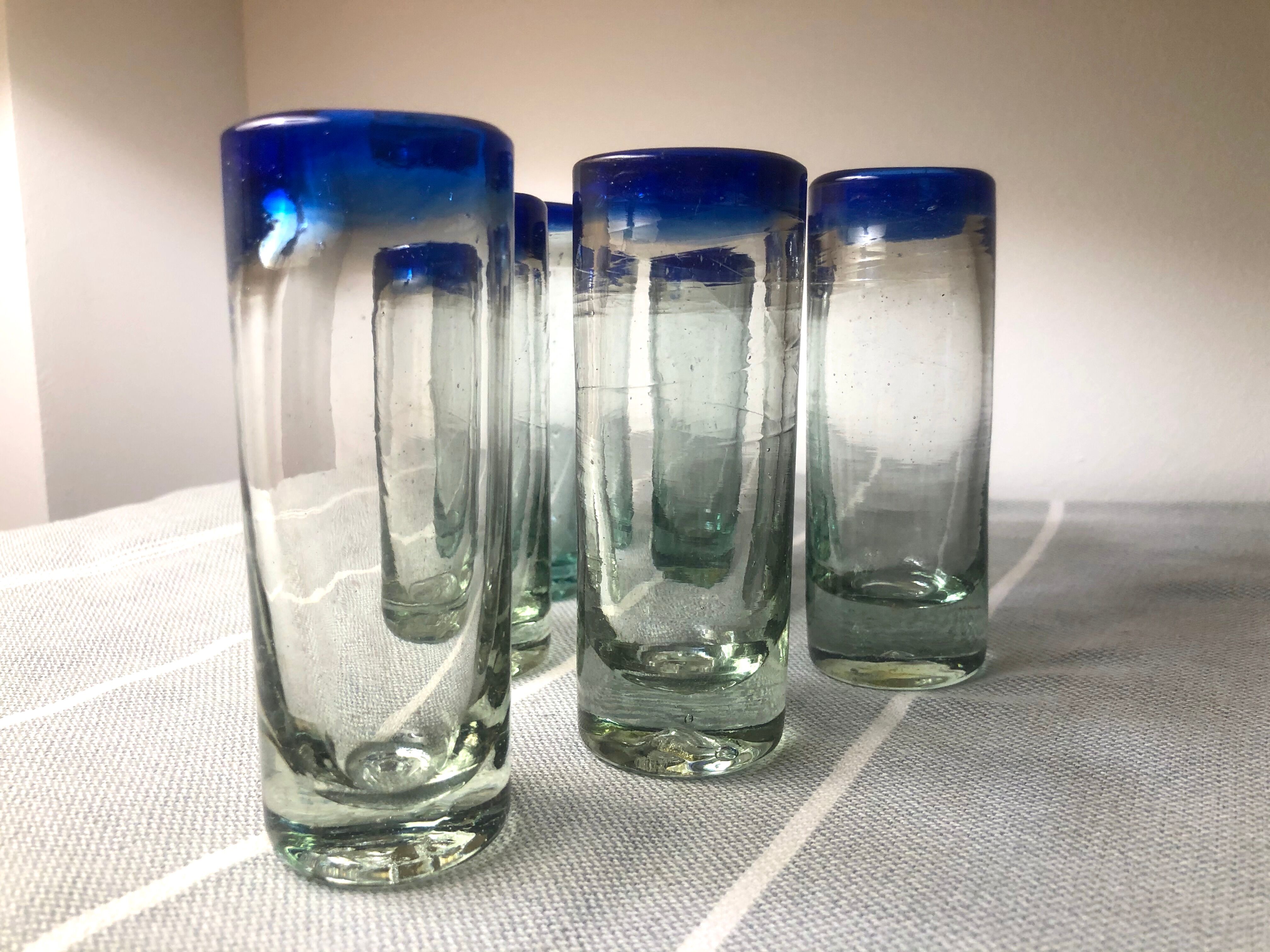 Handmade cobalt blue tequila glasses made of recycled glass
