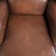 Comfortable cowhide wingback armchair in English style with a timeless look