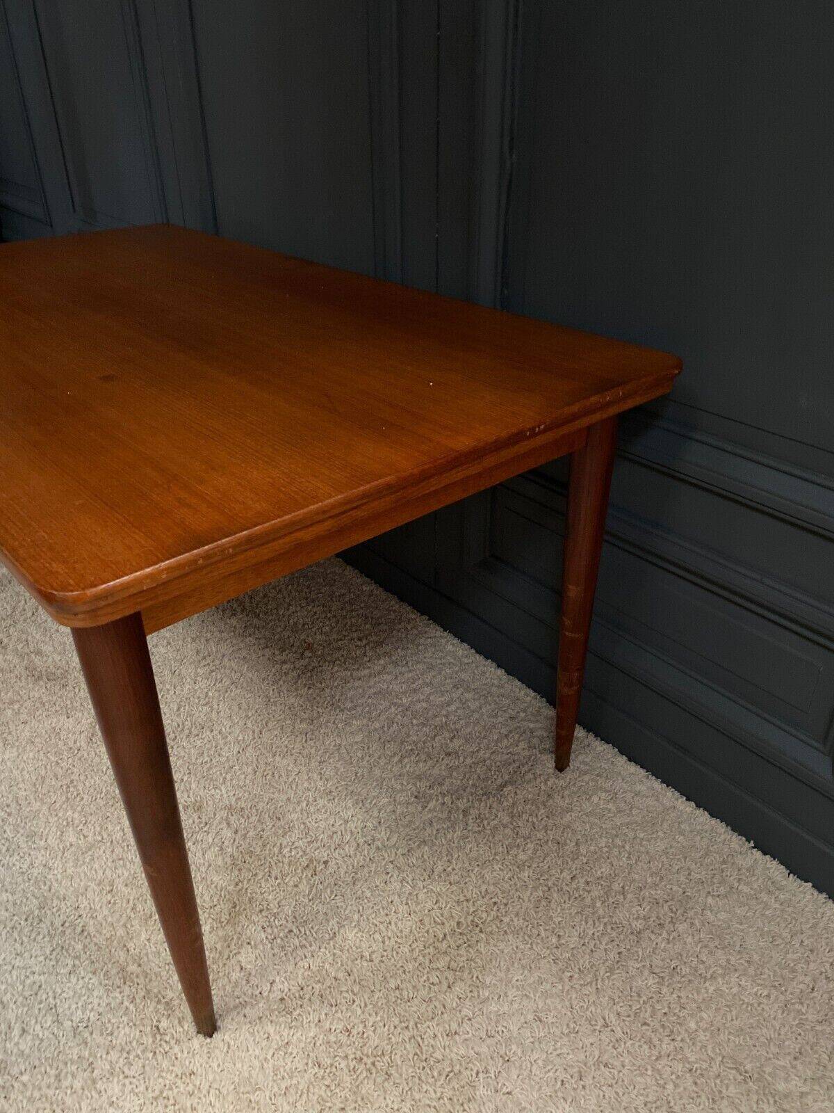 Scandinavian rectangular teak dining table with 4 tapered legs