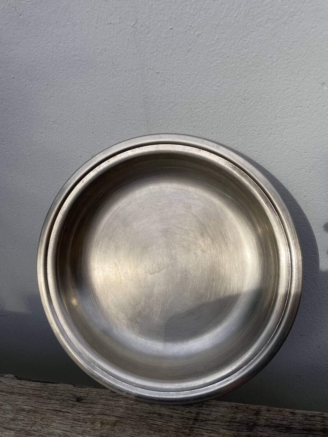 Round silver-plated metal serving dish with hallmark