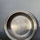 Round silver-plated metal serving dish with hallmark