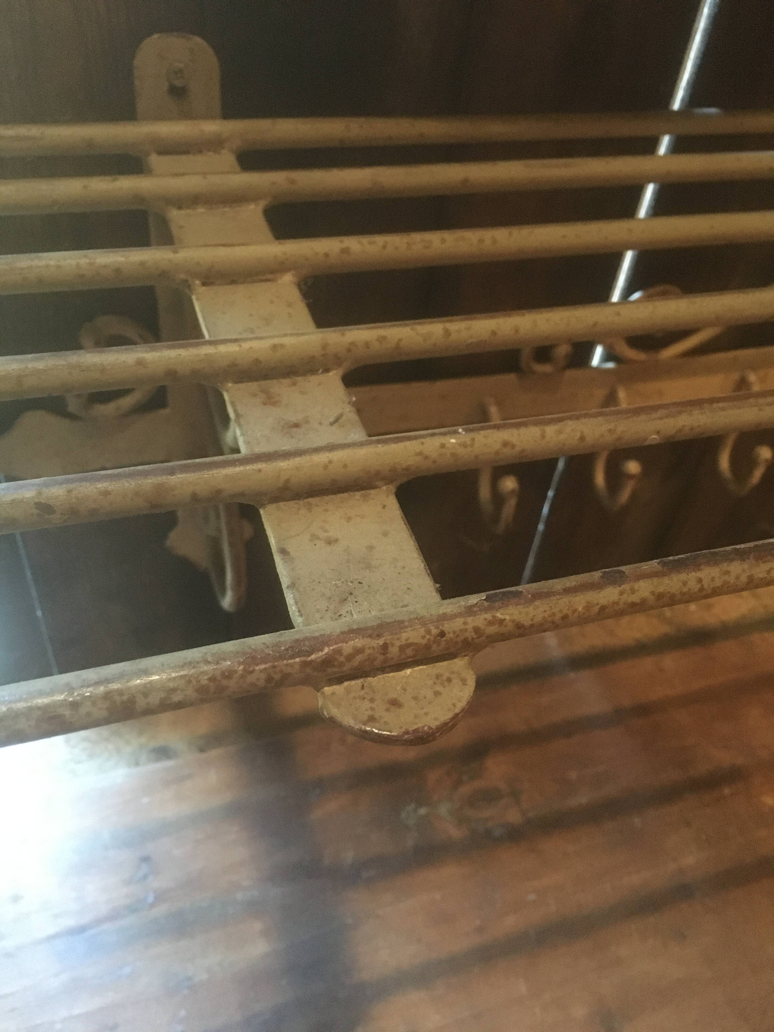 White wrought iron coat and hat rack