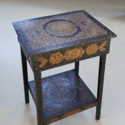Decorated antique side table with elephant