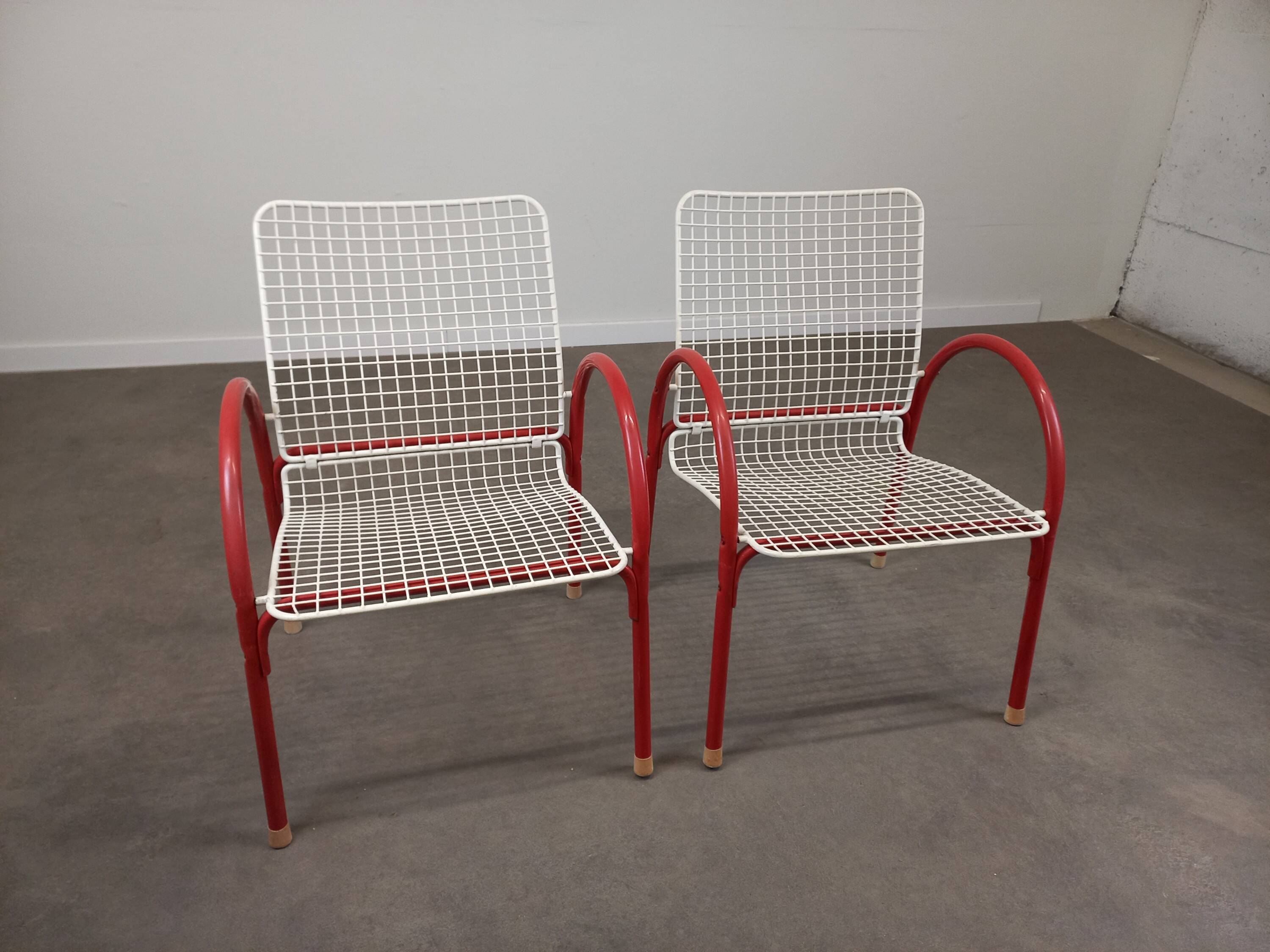 Pair of Emu Rio garden armchairs