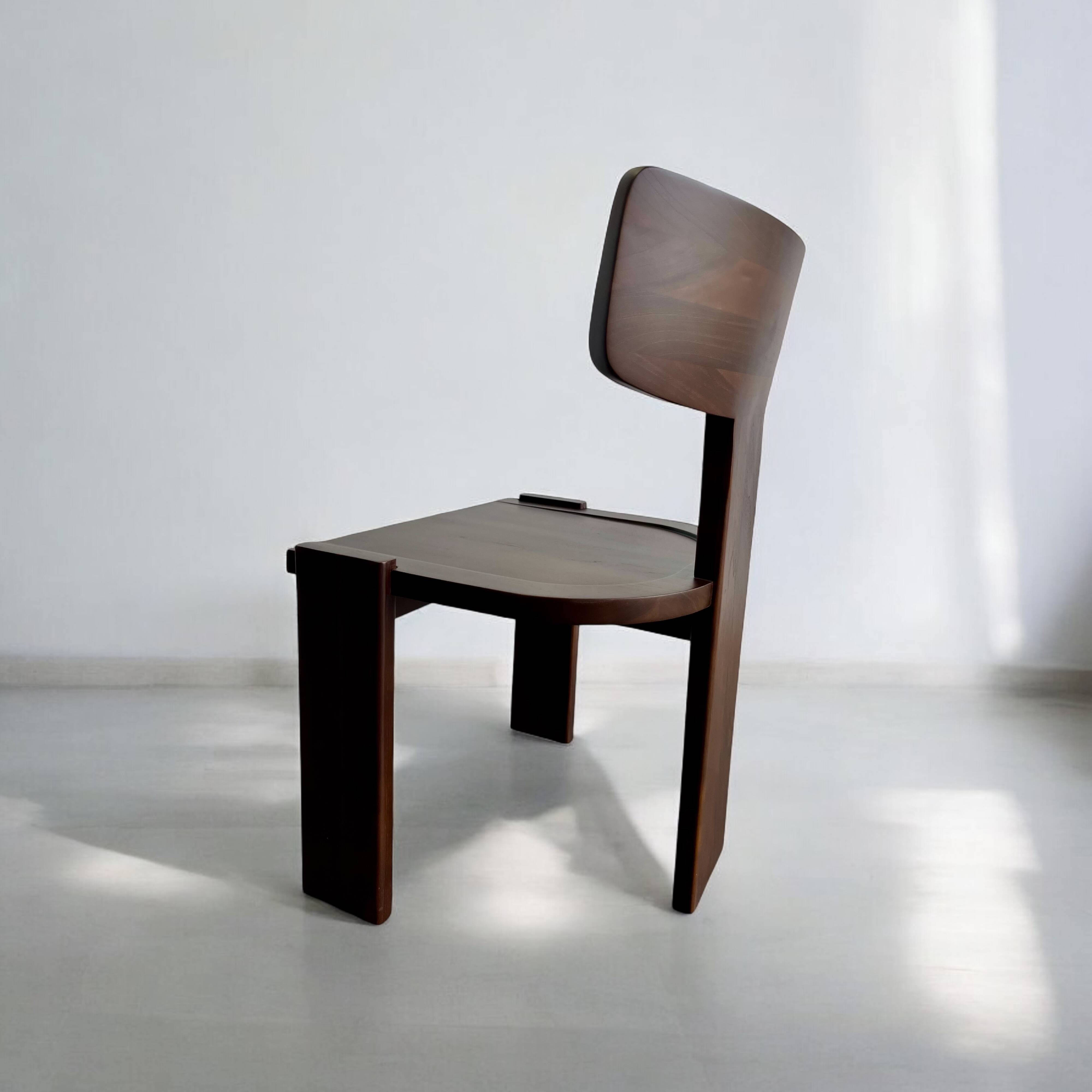 Retro brutalist chair in dark solid wood