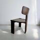 Retro brutalist chair in dark solid wood