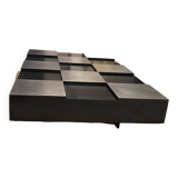 Coffee table with stainless steel checkered top and black formica