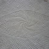 Oval white placemat in crocheted cotton