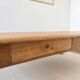 Large farmhouse-style coffee table with drawers, renovated oak.